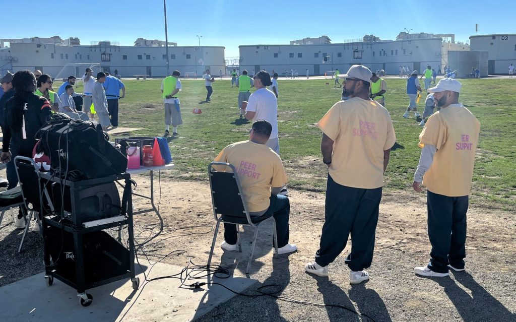 Peer Support Specialist Program participants assist during the new PVSP flag football league game.