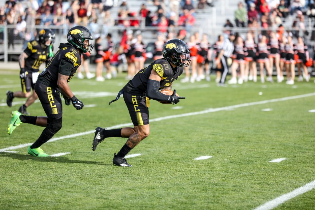 Making a run on the football field.