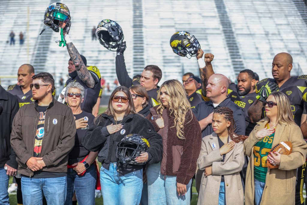 Family of fallen Agent Josha Byrd and teammates at the Guns and Hoses football game in January 2026 in Sacramento, Calif.