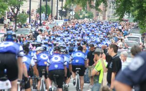 Police Unity Tour in Washington, D.C., with cyclists filling a street.