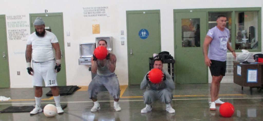Incarcerated men doing exercises at SATF in Corcoran.