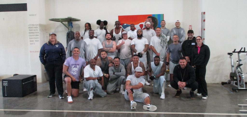 Large group of people at a CrossFit class at Substance Abuse Treatment Facility and State Prison at Corcoran.