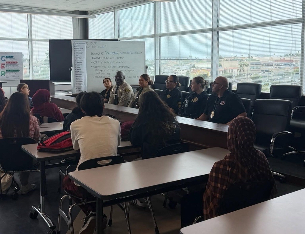 Photo of RJD Officers seated at tables, participating in the STAR/PAL Law Enforcement Panel