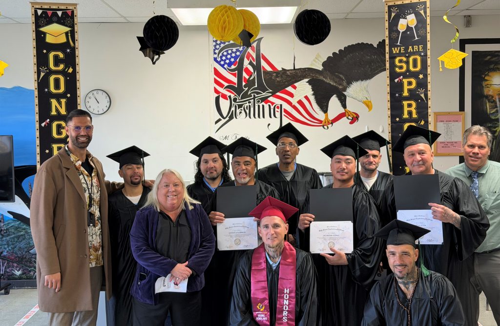 Group photo of incarcerated students with prison staff at Salinas Valley State Prison, Soledad, California, February 2026.