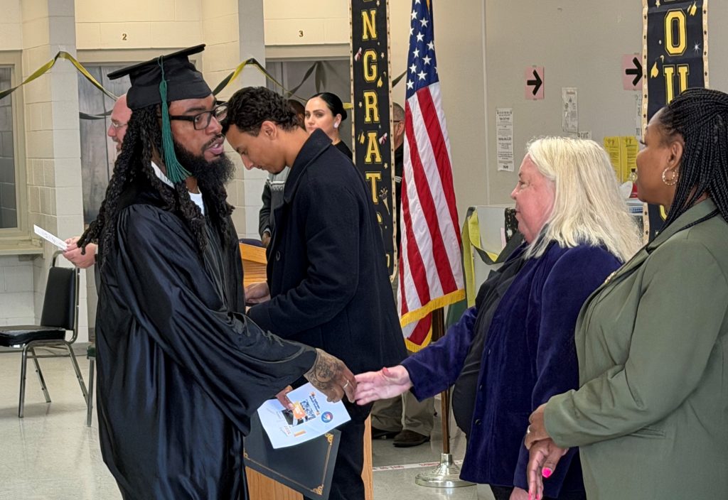 An incarcerated person shakes hands with Warden Kelly Santoro at Salinas Valley State Prison, Soledad, California, February 2026.