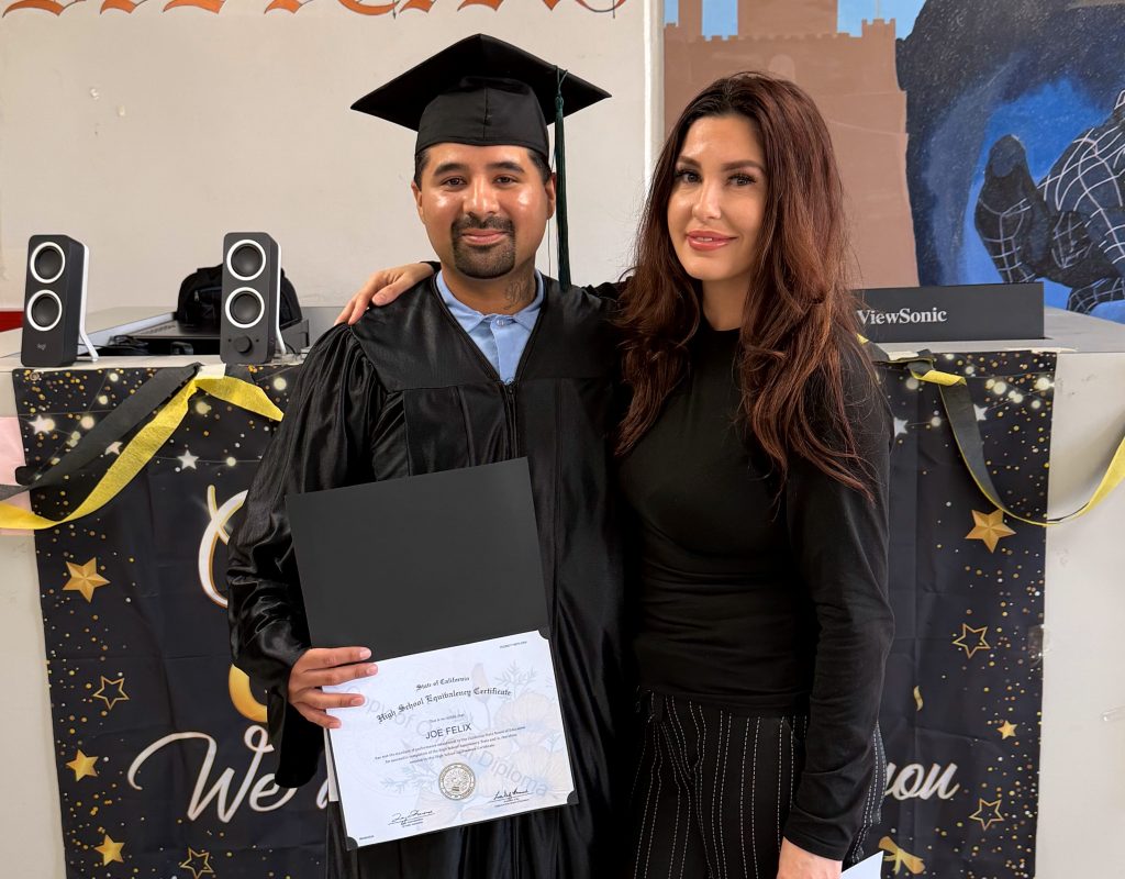 A graduate and a family member at Salinas Valley State Prison.