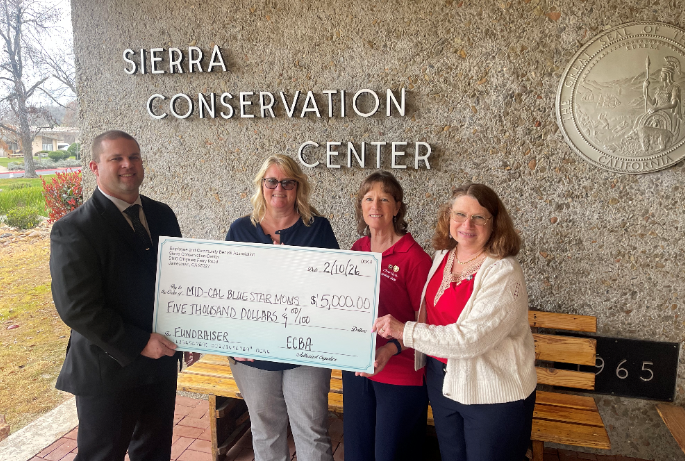 SCC warden presenting check to nonprofit organization