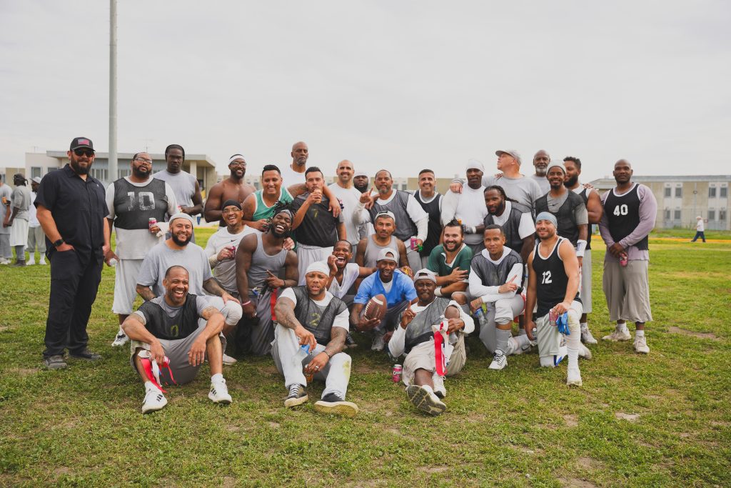 Group photo of players with the CIM coach.