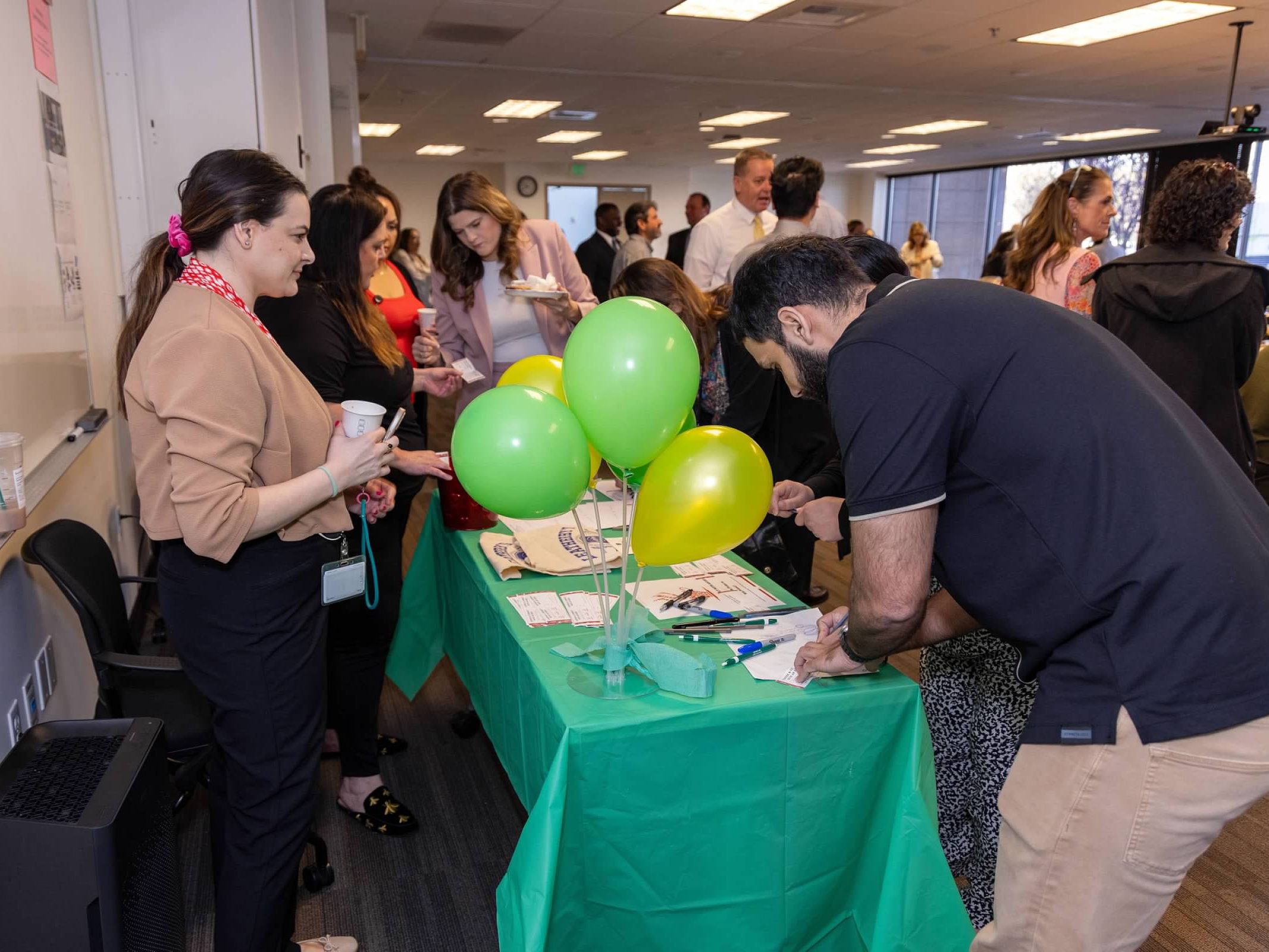 Participants sign in at headquarters coffee and connect event