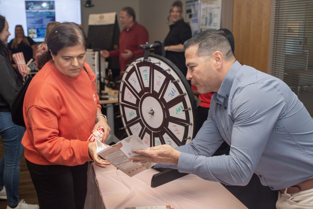 Two staff members interacting at the patient safety fair