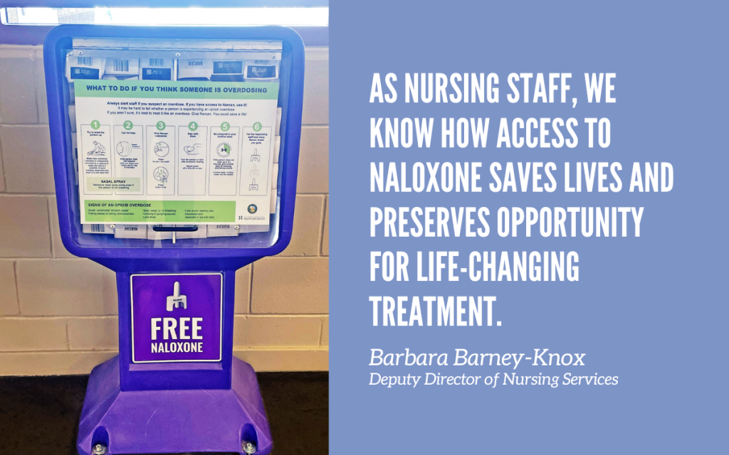 A naloxone dispenser in a CDCR prison with a quote from the head of nursing.
