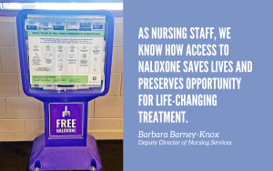 A naloxone dispenser in a CDCR prison with a quote from the head of nursing.