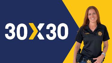 Female parole agent with 30x30 text on graphic