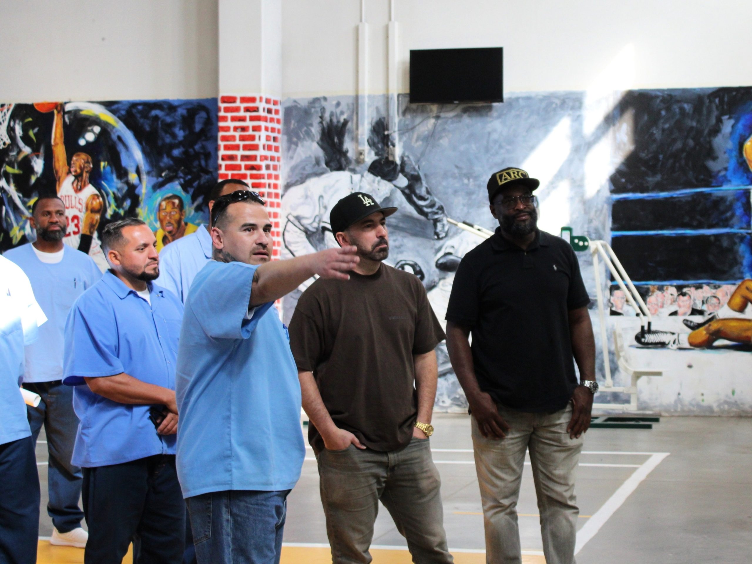 Incarcerated individuals on a facility tour with Scott Budnick