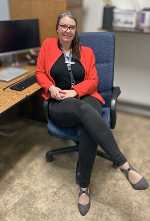 Tessa Gaynor sits at her desk