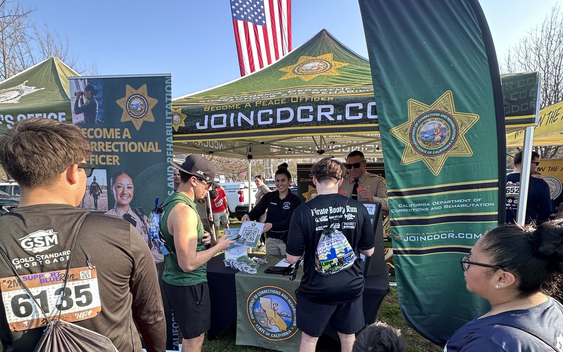 Public members speak with VSP recruiters at the Fresno Support Blue Run.