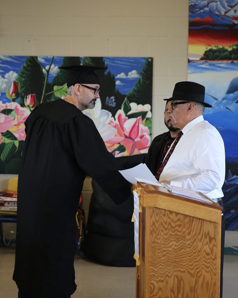 WSP ISUDT graduate shakes hands with WSP staff