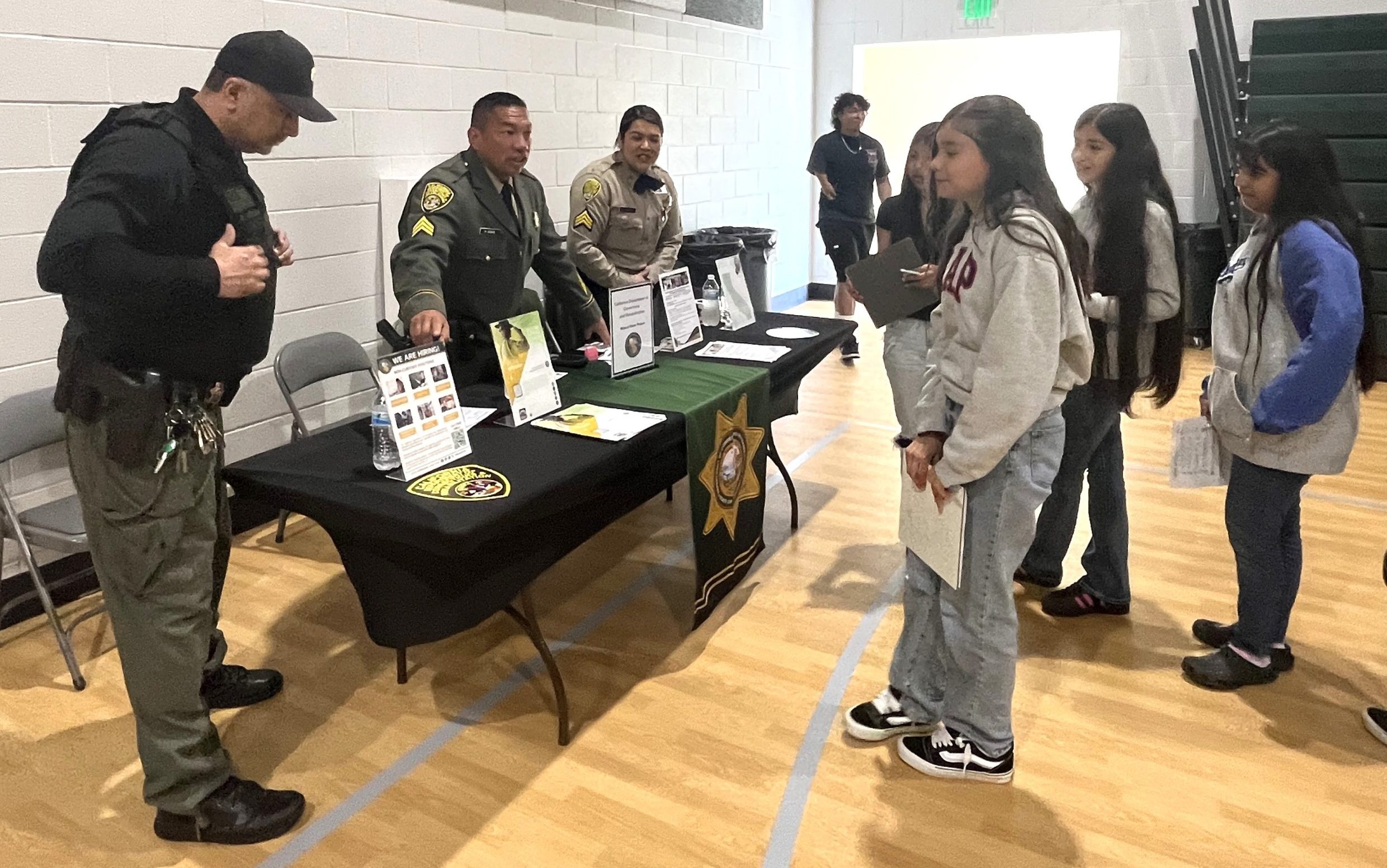 WSP-RC recruiters at a middle school career fair to discuss job options.