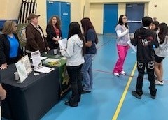 Health and other staff members from WSP-RC speak to middle-school students.