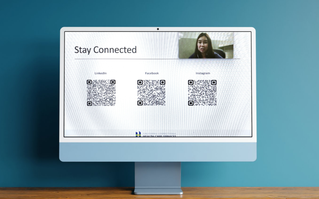 Female staff member speaks virtually on computer creen