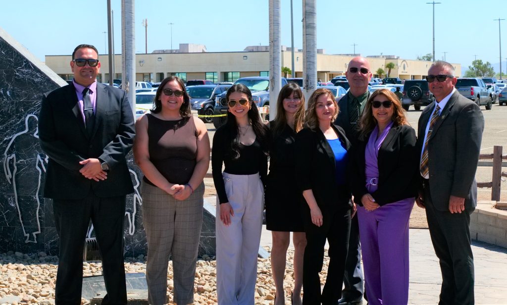 A group of people at Calipatria State Prison for a National Crime Victims' Rights Week observance event.
