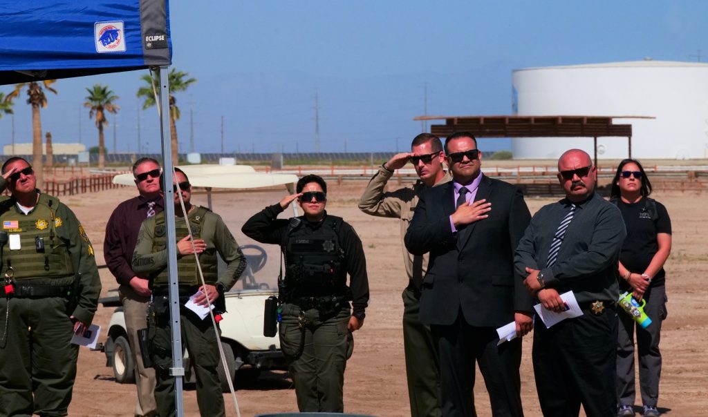 Staff salute at Calipatria State Prison for National Crime Victims' Rights Week event.