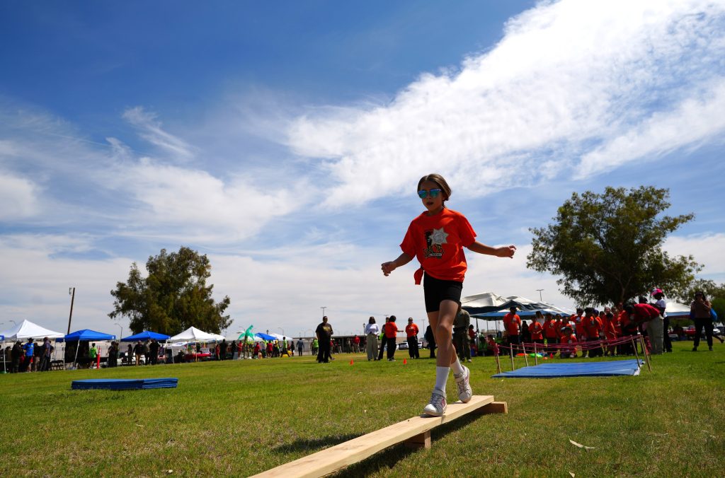 Child on a balance beam, Centinela State Prison Junior Academy.