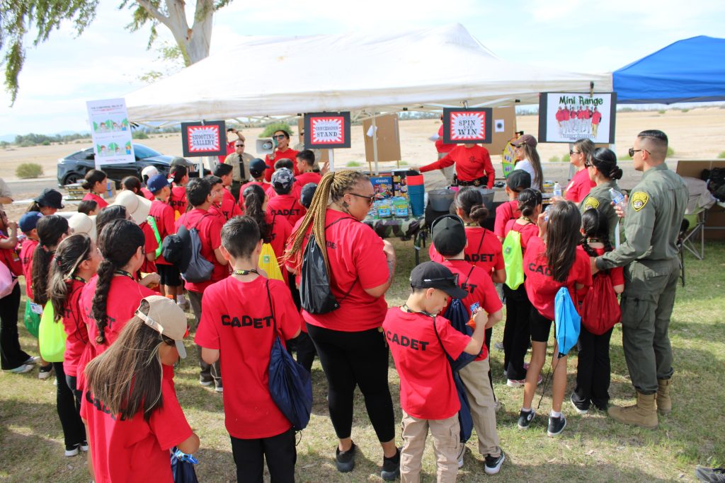 People lined up at the mini-range and concession stand.