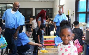 Centinela State Prison incarcerated persons hide eggs for their children during Easter visiting.
