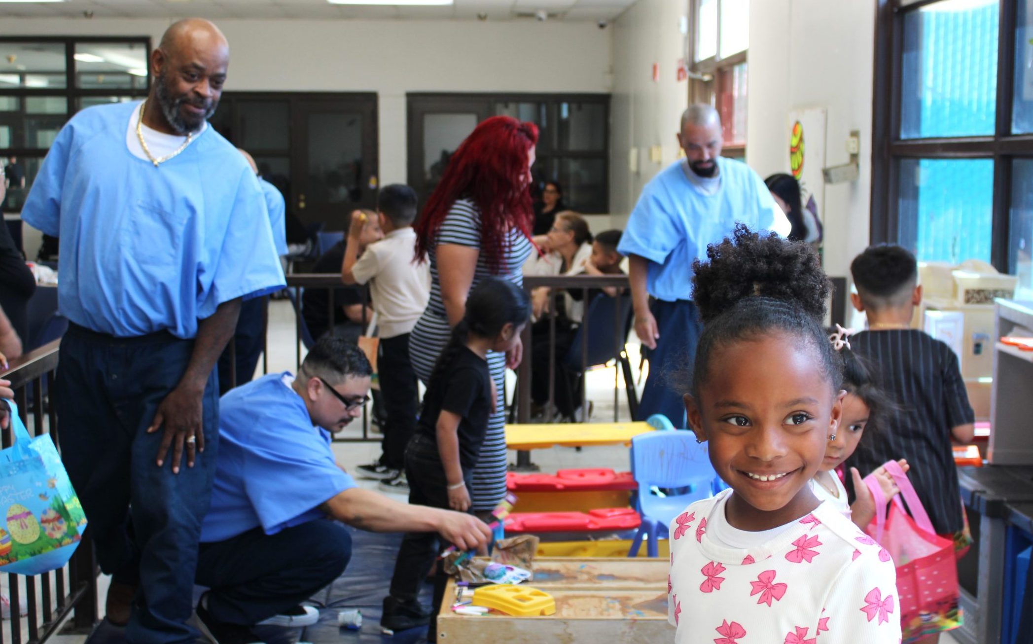 Centinela State Prison incarcerated persons hide eggs for their children during Easter visiting.