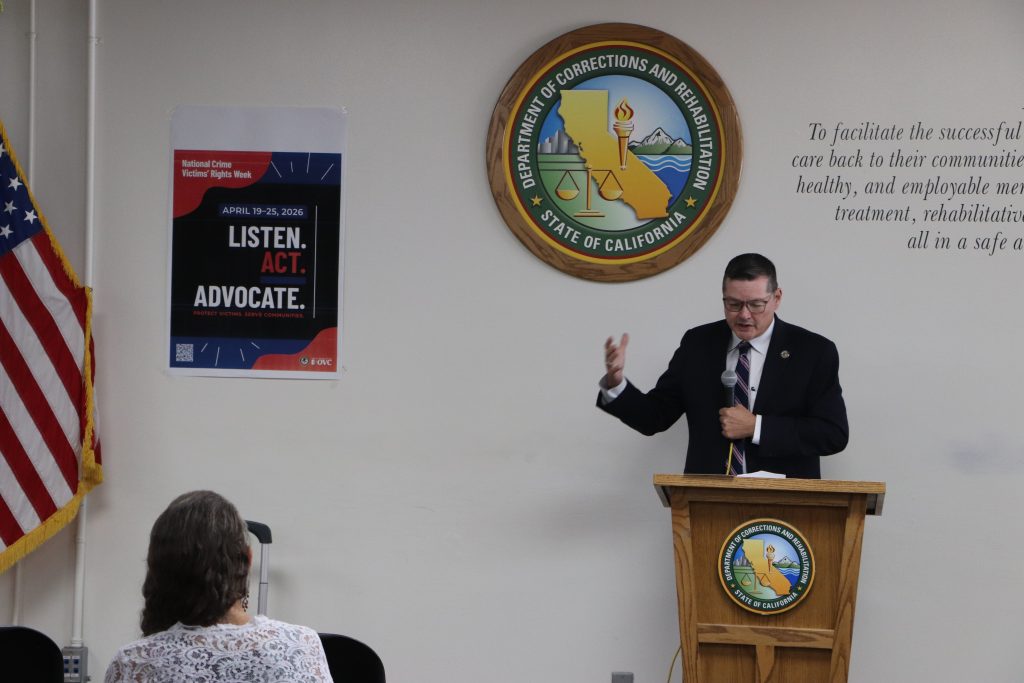 District Attorney speaks at a ceremony at Centinela State Prison.