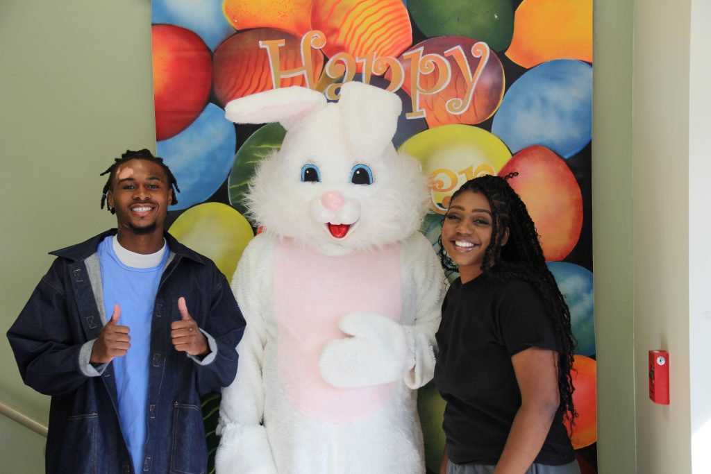 A man and woman pose for a photo with the Easter bunny at CHCF in Stockton.