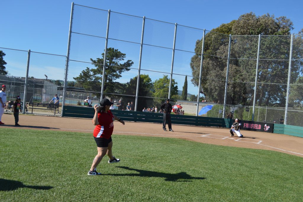 CSP SOL staff member Veronica Mitchell throwing first pitch to son who is player on the Fairfield Falcons baseball team