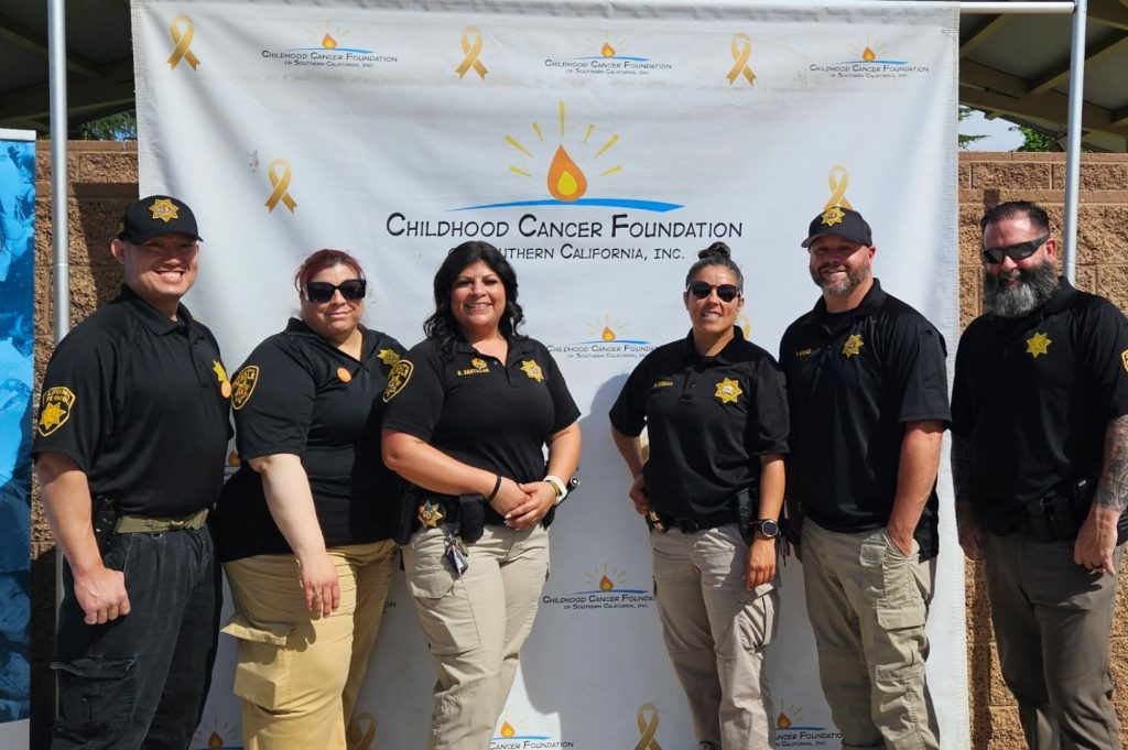 Group photo of Tri-County Parole District staff at the Easter Extravaganza event.