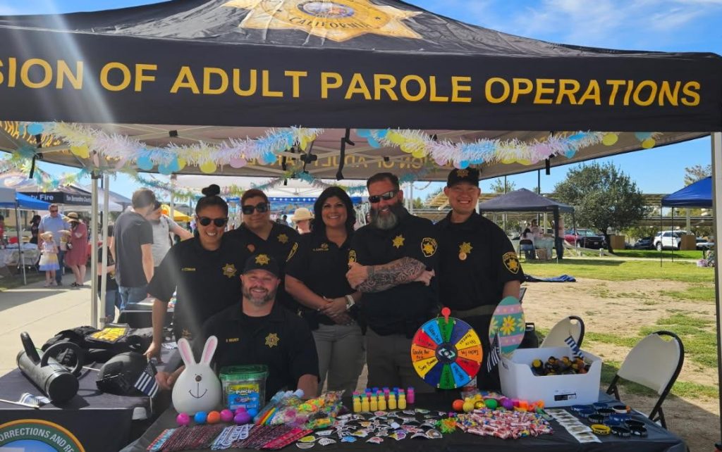 Easter event with parole staff at a booth.