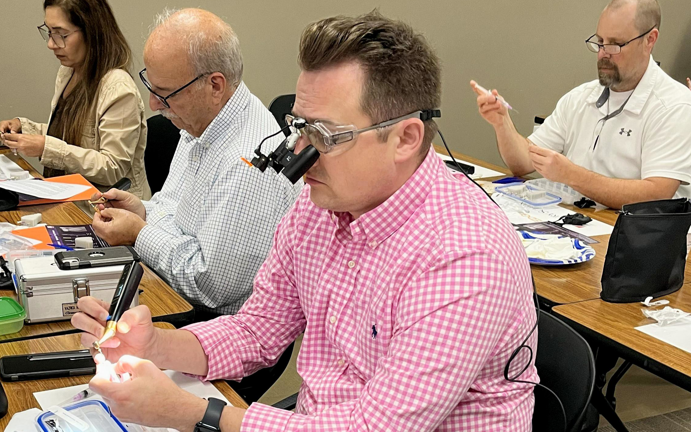 Statewide dental staff from CCHCS receive training to perform root canals in prison clinics.