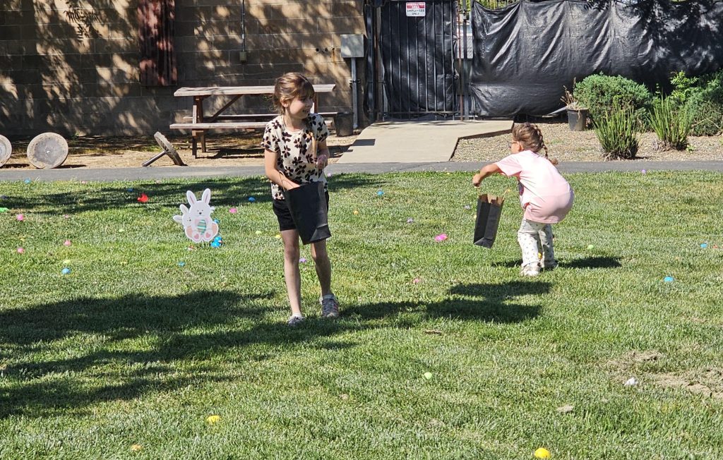 Children hunt for eggs at the Female Community Reentry Program-Sacramento during a visitation event.