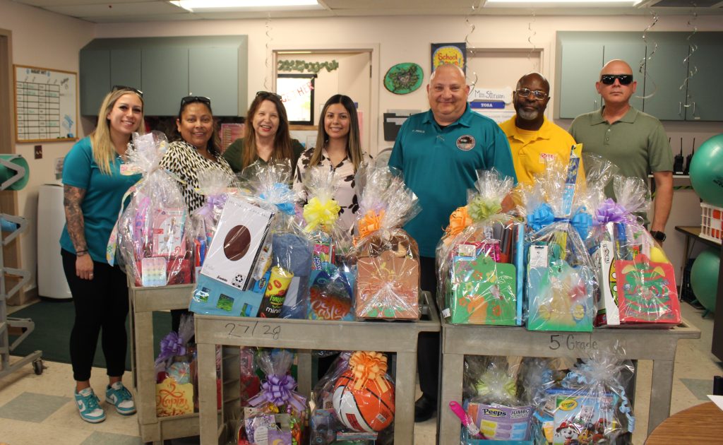 Ironwood State Prison staff delivering Easter baskets to elementary schools.