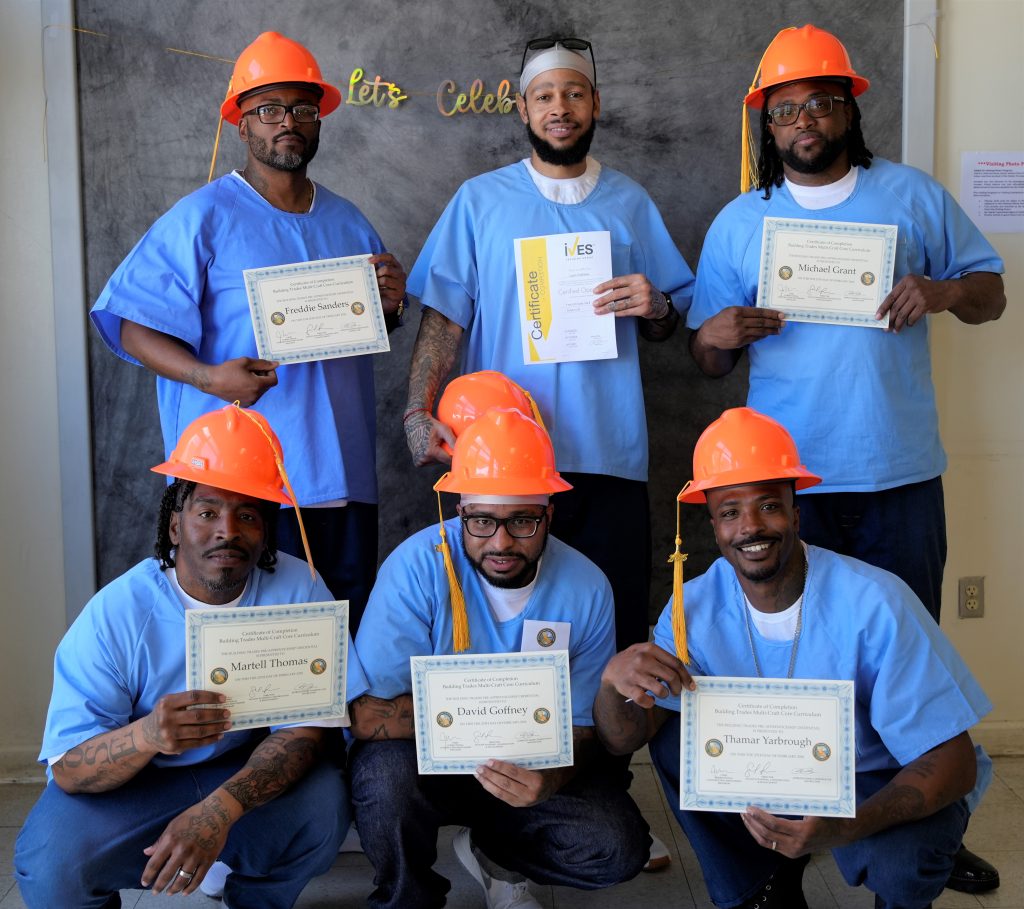 Six construction program graduates at LAC.