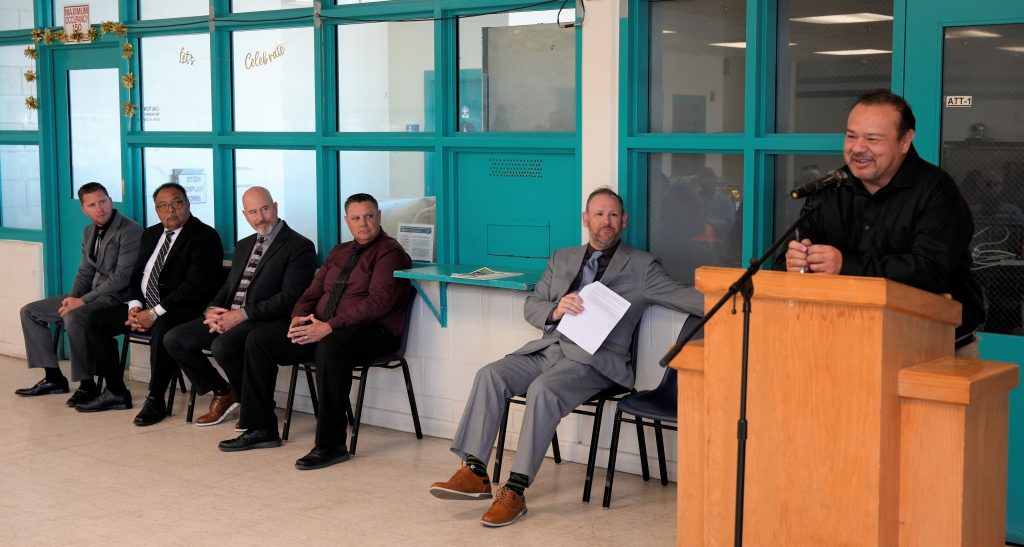 CDCR construction staff speak at the graduation ceremony at LAC.