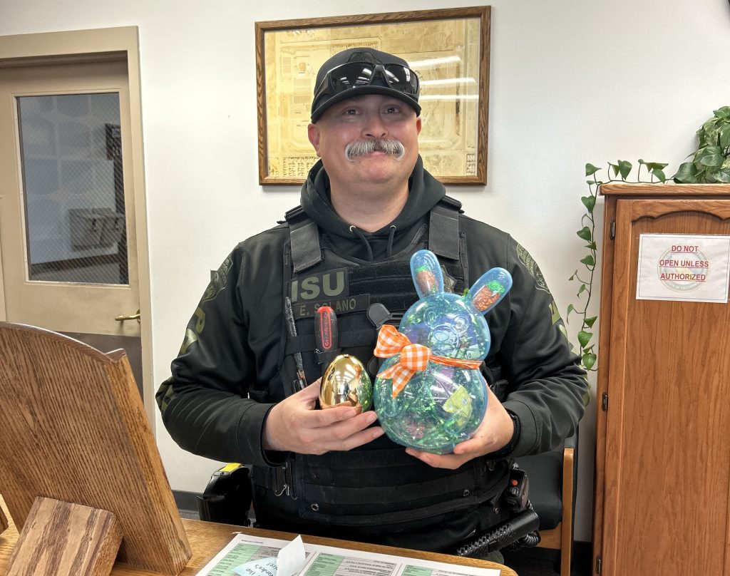 An ISU staff member with a golden egg at LAC.