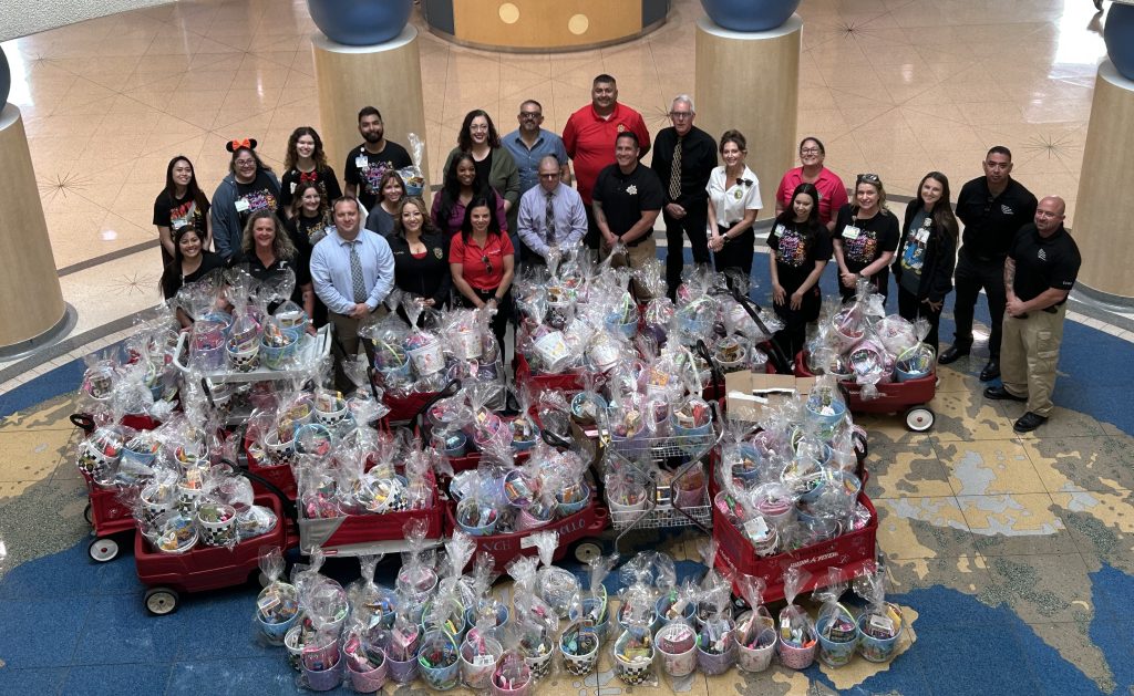 Group photo of staff from North Kern State Prison donating gift baskets to Valley Children's hospital.