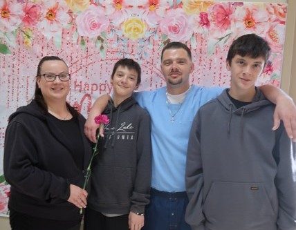 A family during Mother's Day visiting at Avenal State Prison, May 2026.