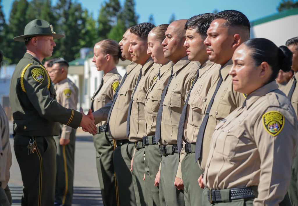 Shaking hands with cadets.