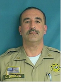 Carlos Borges, a retired correctional sergeant, passed away. He's seen here in a staff photo wearing his uniform.