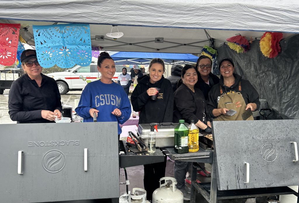 Staff members working a gas cooktop for a taco contest at CCI-Tehachapi, May 5, 2026.