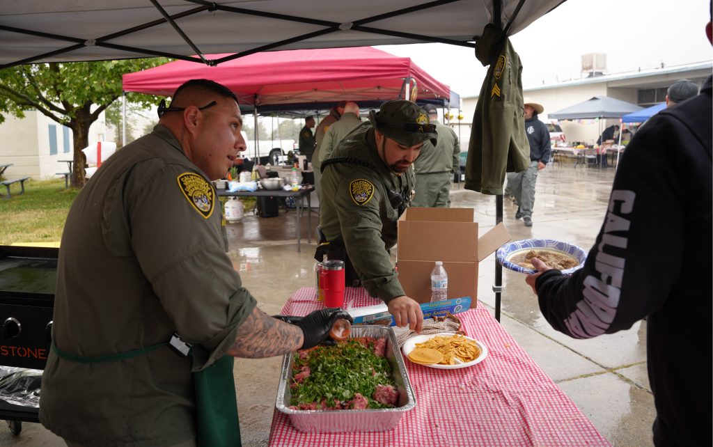Officers create tacos at CCI.