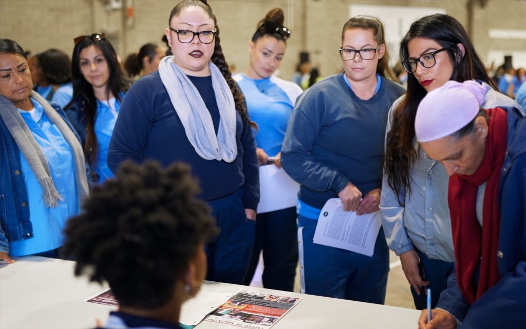 Incarcerated students at CCWF attend a college fair.