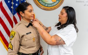 New sergeant Ruan is pinned by her mother at Centinela State Prison.