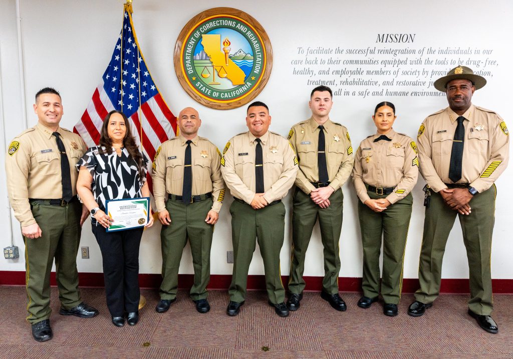 Centinela State Prison promotions of new sergeants, the acting chief deputy warden and acting warden in a group photo.